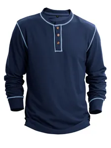 Detail view of navy waffle knit fabric and light blue contrast stitching on men's shirt