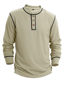 Close-up view of men's waffle knit long sleeve Henley shirt in beige with contrast piping