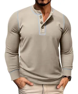 Macro detail view of men's waffle knit Henley long sleeve shirt with blue contrast stitching