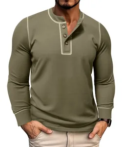 Close-up of olive green waffle knit men's long sleeve henley shirt with contrast stitching