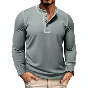 Slim fit men's waffle knit long sleeve Henley T-shirt in grey, textured casual top.