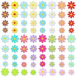 Detailed view of colorful flower embroidery patches in various sizes and vibrant colors