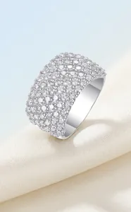 Macro shot of a brilliant S925 silver band ring featuring multiple rows of sparkling moissanite