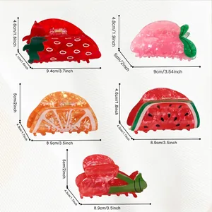 Dimensiones detalladas de pinzas para el cabello con formas de fresa, sandía y frutas
