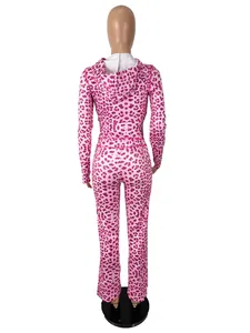 Back view of a vibrant pink leopard print hooded cardigan and long trousers set on a mannequin.