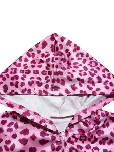 Close-up of pink leopard print hoodie showing fabric texture and zipper detail