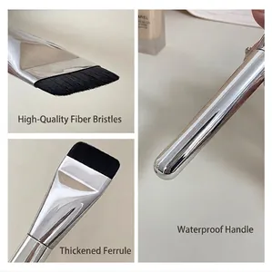 Macro view of ultra-thin flat head foundation brush bristles and chrome handle