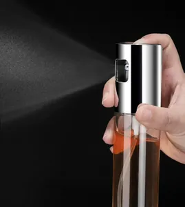 Detailed view of the stainless steel nozzle spraying a fine and uniform oil mist
