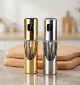 Close-up detail of the press-type oil spray bottle nozzle with gold and silver caps.