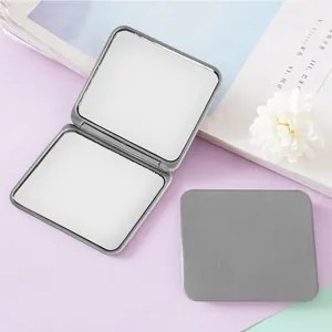 Silver foldable double-sided square pocket mirror showing open and closed views