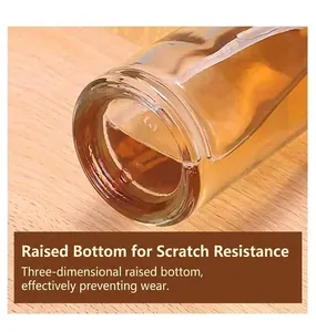 Detail showing the reinforced raised bottom of the glass oil spray bottle for kitchen