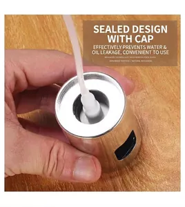 Close-up detail of stainless steel oil sprayer pump head and inner sealing structure