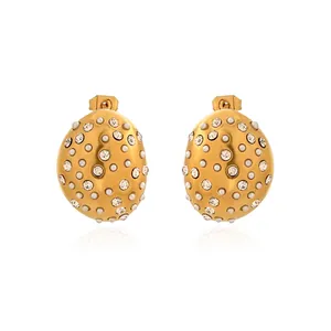 Detailed view of gold-plated stainless steel oval earrings with pearls and crystals