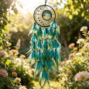 Detailed view of handmade turquoise dreamcatcher with tree of life motif in a sunny garden