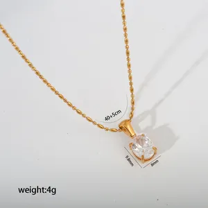 Detail view of gold stainless steel necklace with oval crystal pendant and size info