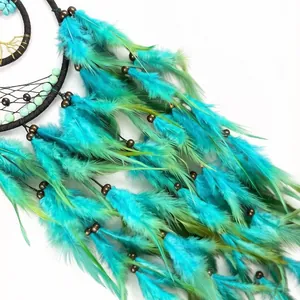 Handmade turquoise and green feather dreamcatcher with wooden beads wall hanging.