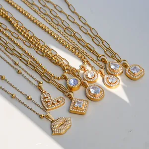 Gold-plated stainless steel necklaces with geometric pendants and shimmering zirconia