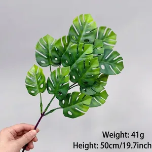 Close-up of artificial Monstera leaf branch showing 50cm height and 41g product weight