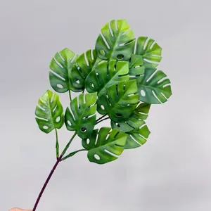 Realistic artificial Monstera deliciosa leaf branch for tropical home and office decor