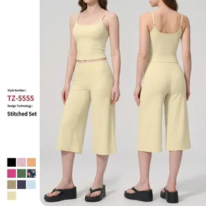 Pale yellow two-piece yoga set featuring a camisole top and cropped wide-leg culottes