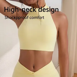Close-up of a light yellow high-neck halter yoga sports bra with matching leggings.
