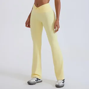 Detailed view of pale yellow V-waist flared yoga pants for women's fitness and daily gym