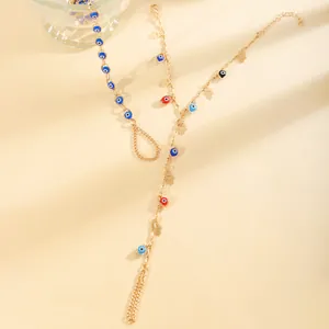 Gourmette hamsa dorée avec œil maléfique, perles colorées et charmantes breloques
