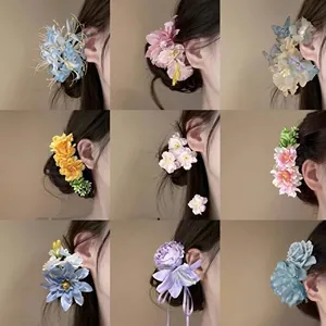 Detailed grid view of diverse silk flower hair clips in vibrant colors for elegant women