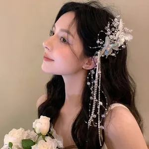 Elegant white bridal floral hair accessory with long dangling crystal tassels for wedding