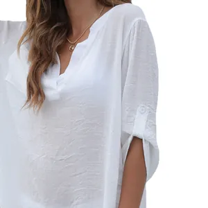 Elegant white woven beach bikini cover-up blouse featuring a deep V-neck and button tab sleeves