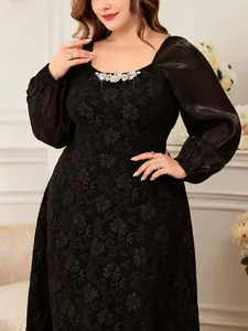 Detail of black plus size jacquard dress with rhinestone neck and puff sleeves