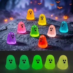 Colorful miniature ghost figurines with glow-in-the-dark effect for Halloween decor.