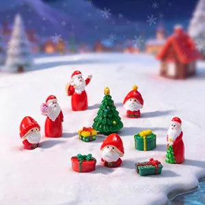 Close-up of miniature Christmas figurines set including Santa and trees on snow