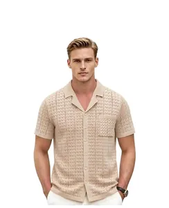 Front view of beige knit polo shirt with Cuban collar and textured pointelle pattern