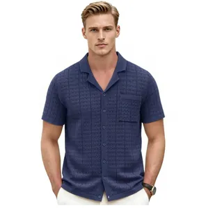 Close-up detail of a men's blue knit short-sleeved polo shirt with a Cuban collar.