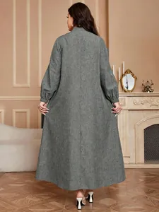 Elegant back view of a plus size grey textured A-line long dress with lantern sleeves