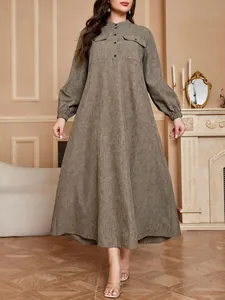 Front view of a plus size long-sleeved A-line maxi dress with a stand collar.