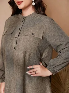 Detailed view of grey textured plus size dress with mandarin collar and lantern sleeves
