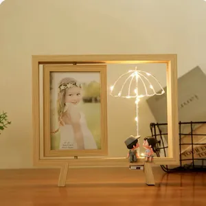 Creative rotating wooden photo frame with couple figurines and warm LED light