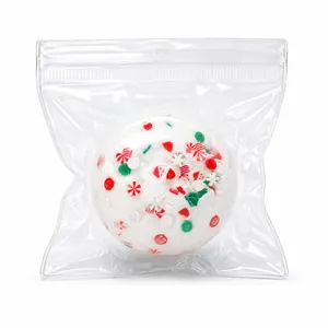 Pallina antistress natalizia fatta a mano con decorazioni di caramelle in busta