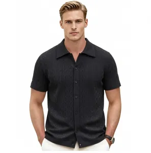 Detail of a men's black wave pattern jacquard short sleeve knitted button-up polo shirt