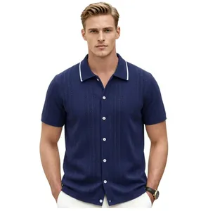 Close-up detail of a navy blue knit polo shirt featuring an elegant white-tipped collar.