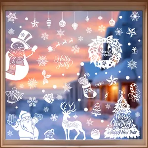Close-up of white silhouette Christmas static window stickers on a glass window
