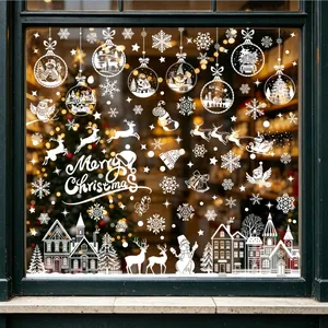Detailed view of white Christmas window stickers with winter town silhouette design