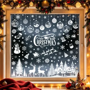 Detailed view of white Christmas window silhouettes with Merry Christmas typography