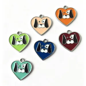 Group of heart-shaped colorful metal pet ID tags with cute dog faces