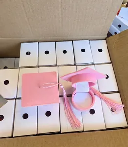 Pink velvet graduation cap jewelry box with tassel in bulk packaging detail