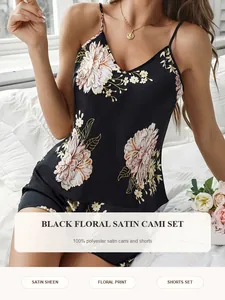 Close-up detail of the elegant black floral satin camisole and shorts set with soft fabric