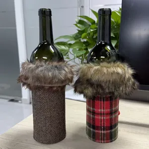 Detailed view of Christmas wine bottle sleeves with plaid and herringbone fabric and faux fur.