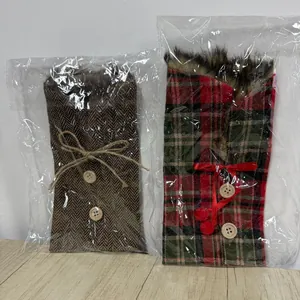 Festive Christmas wine bottle covers with plaid and herringbone patterns in plastic bags